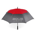 A large umbrella with a red top and gray canopy stands upright showcasing the text aqua UV-PROTECTION on the surface indicating its purpose for sun protection