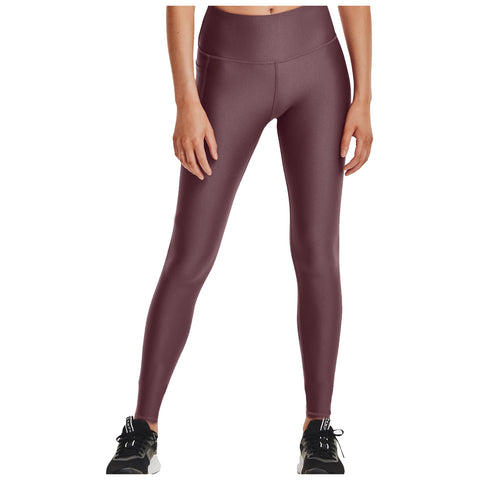 Leggings in a deep maroon color are displayed, featuring a high waistband and a smooth finish. They are paired with black athletic shoes, creating a sporty look.