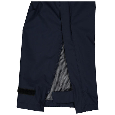 A pair of dark fabric pants is shown with an open zipper on one leg revealing a mesh lining and a velcro strap at the hem edges indicating functionality and style.