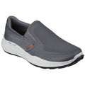 A gray slip-on shoe rests on a white background featuring a textured surface and a contrasting white sole designed for comfort and ease of wear with a casual style.