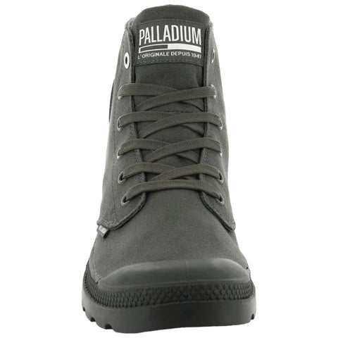 A gray high-top boot stands upright with laces tied and a rubber toe cap showcasing its rugged design meant for casual or outdoor wear in various environments. Text on the boot reads PALLADIUM L'ORIGINALE DEPUIS 1947.