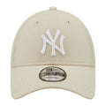 A beige baseball cap features a white embroidered NY logo on the front and has a curved brim with adjustable sizing for the wearer. The cap is made of mesh material.