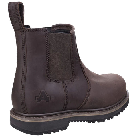 A brown leather ankle boot features a rubber sole with a rugged tread and elastic side panels the boot is standing upright on a plain white background