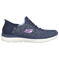 A navy blue athletic shoe with a textured upper is displayed from the side featuring a sleek design laced with purple accents and a white sole providing cushioning and support.