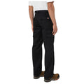 Black cargo pants are worn by a person standing with their back facing the viewer showing multiple side pockets and a logo on the waistband in a neutral background.