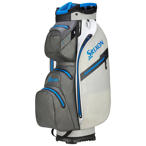 A golf bag stands upright showcasing multiple compartments and pockets in gray and white with blue accents. The brand name Srixon is prominently displayed on the bag's side.