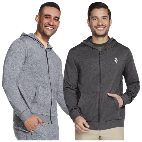 Two men are smiling while wearing hooded sweatshirts one in light gray and the other in dark gray both feature zipper fronts and are in a casual setting