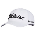 A white cap features prominent black embroidered lettering reading Titleist on the front and Pro V1 on the side, designed for outdoor wear, particularly in golf contexts.