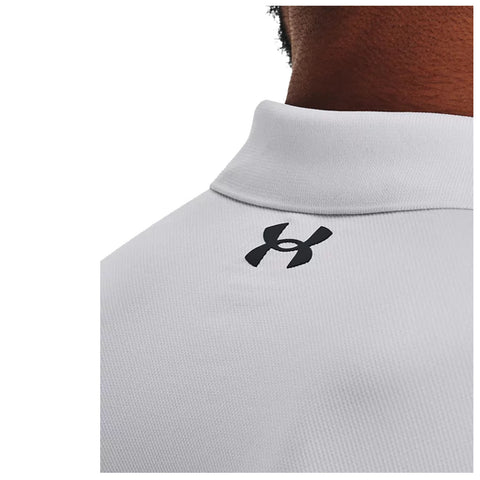 A white polo shirt is displayed with a black logo on the back of the collar while the fabric texture is clearly visible showcasing its sporty design and style.