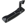 A black golf putter rests on a flat surface highlighting its sleek design with a prominent white line along the head and an emblem visible on the side.