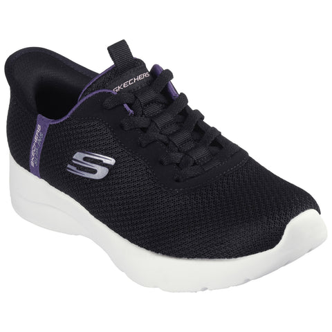 A black athletic shoe with a mesh upper is positioned upright showcasing its rounded white sole and lace-up design featuring a small purple accent and a silver logo on the side.