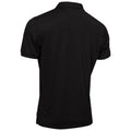 A black polo shirt is displayed from the back hanging against a neutral background showcasing a simple design and short sleeves suitable for casual or semi-formal wear.