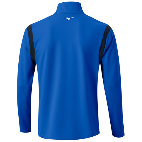 A blue long-sleeved sports shirt is shown from the back featuring black shoulder accents and a small logo near the collar in a neutral setting without additional elements.