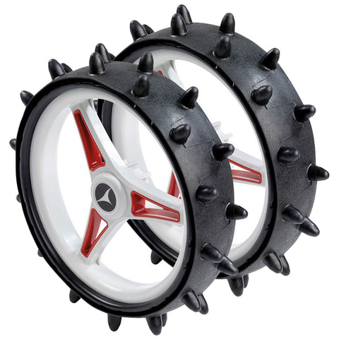 Two black wheels featuring white spokes and red accents are depicted with protruding spikes around their circumference designed for enhanced grip in various terrains