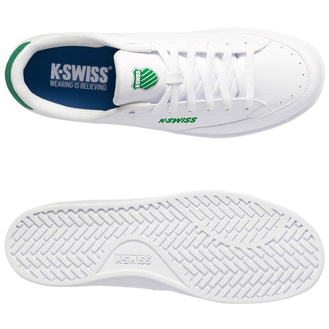 A pair of white K-Swiss sneakers is displayed with a green logo and branding. The shoes are shown from above and below, highlighting the smooth surface and textured sole.