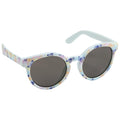 Colorful sunglasses with butterfly patterns rest in a neutral background showcasing their rounded shape and dark lenses ready for sunny outdoor use.