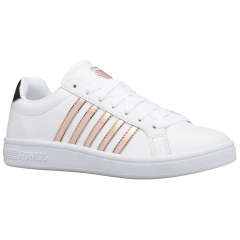 A white sneaker with rose gold accents features a smooth upper surface and six eyelets for laces displaying a casual design suitable for everyday wear in urban environments.