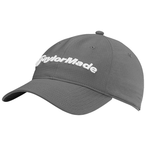 A gray cap with a curved brim sits at an angle revealing the white embroidered text "TaylorMade" on the front indicating a logo associated with golf equipment.