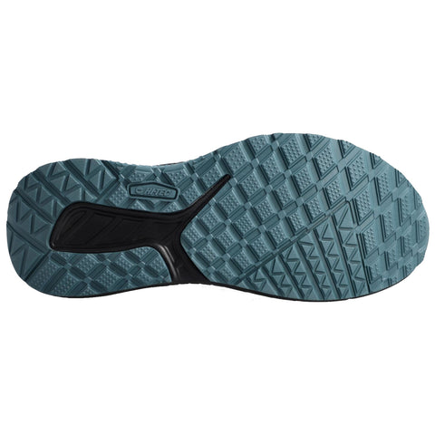 A shoe sole with a textured surface designed for traction rests flat showcasing a light blue color and black accents surrounded by a white background.