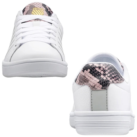 White sneakers featuring a textured pink and black snake print on the back are positioned upright with laces done up showcasing a casual, stylish design suitable for everyday wear.