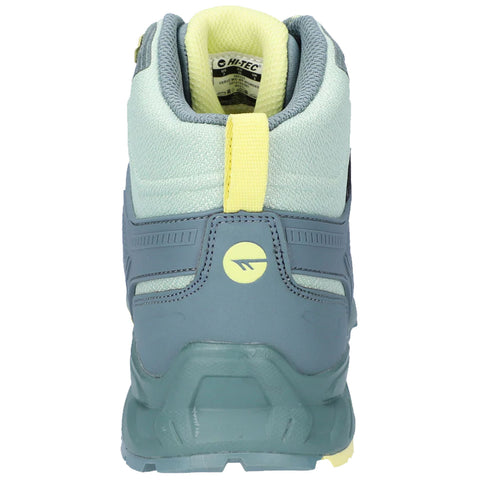 A hiking boot displays a light blue and green design with yellow accents positioned upright against a neutral background indicating its intended use for outdoor activities.