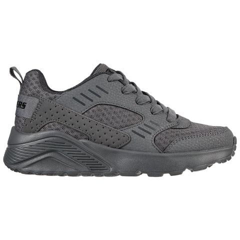 A pair of gray athletic shoes sits on a flat surface showcasing a mesh and synthetic upper with a textured sole and lacing system highlighting a sporty design suitable for casual wear or exercise.