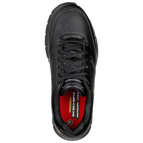 A black sneaker with a textured leather upper is positioned facing upwards displaying laces and a vibrant red insole labeled Skechers Memory Foam in a neutral background.