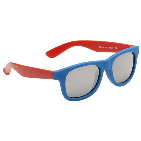 Blue sunglasses with mirrored lenses are sitting upright on a flat surface. The frame features red arms with a speckled pattern, creating a vibrant and playful design suitable for children.