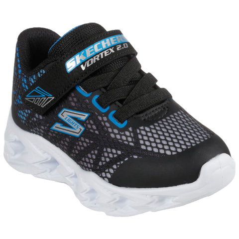 A black and blue sneaker with mesh detailing and a white sole sits on a flat surface highlighting its design features for active wear. The shoe has a Velcro strap and is labeled Skechers Vortex 2.0.