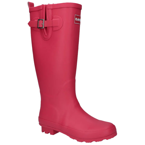 A bright pink rubber boot stands upright showcasing its tall design and buckle detail on the side suggesting suitability for wet or muddy conditions in outdoor environments.