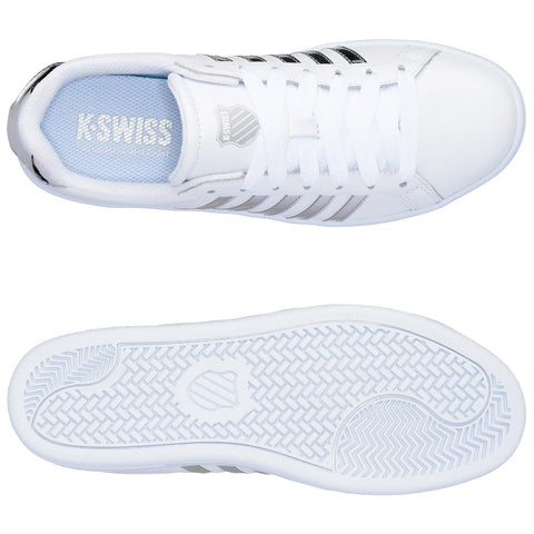 A pair of white athletic shoes with black stripes are positioned on a flat surface showcasing both the top view and the sole emphasizing style and grip features. The insole reads K-SWISS.