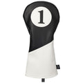 A golf club headcover stands upright featuring a black and white design with a prominent number one displayed on its front, indicating it is designed for a driver club.