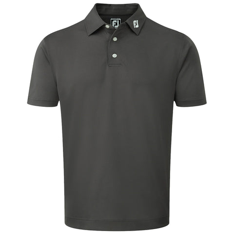 A dark green polo shirt is displayed upright with a collar and three buttons at the neck featuring a logo on the collar. The background is plain and neutral.