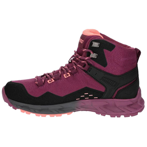 A purple and black hiking boot features a high ankle design with pink accents and reflective elements. It is positioned on a plain background, showcasing its rugged sole optimized for outdoor terrain.