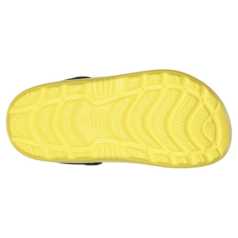 A yellow shoe sole with a textured pattern rests flat, showcasing tread details designed for grip, likely intended for outdoor or sports use in various environments.