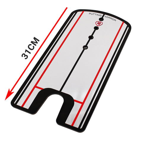 A rectangular putting mirror is positioned horizontally displaying alignment lines and holes designed for golf practice measuring 31 cm in height indicating use for improving putting technique.