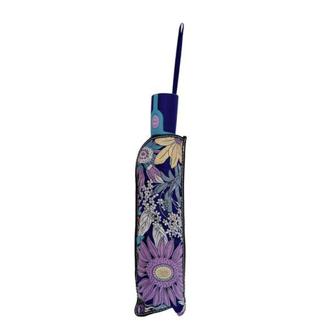 A floral-patterned umbrella is opened and positioned upright displaying a vibrant design of various colorful flowers against a dark background suitable for protection from rain or sun.