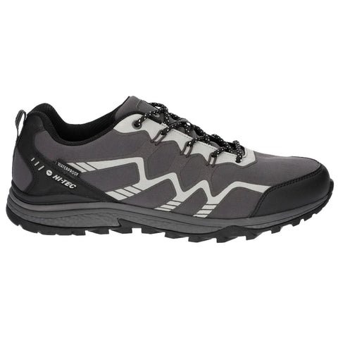 A gray waterproof shoe features a sporty design with black and white accents and textured sole for traction resting on a plain white background suggesting it is intended for outdoor activities.