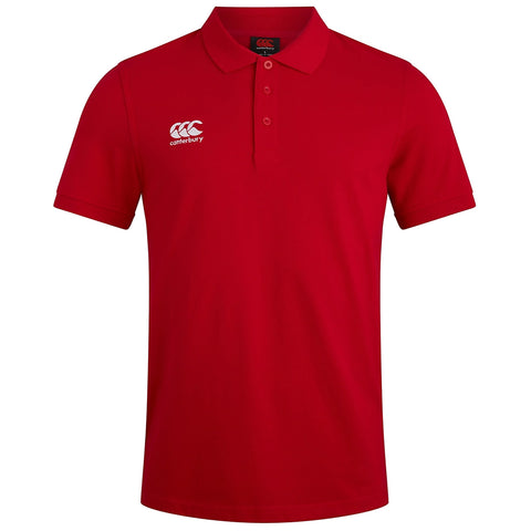 A red polo shirt is displayed upright showcasing a collar and three buttons in front featuring a white logo on the left side that reads CCC canterbury representing a brand identity.