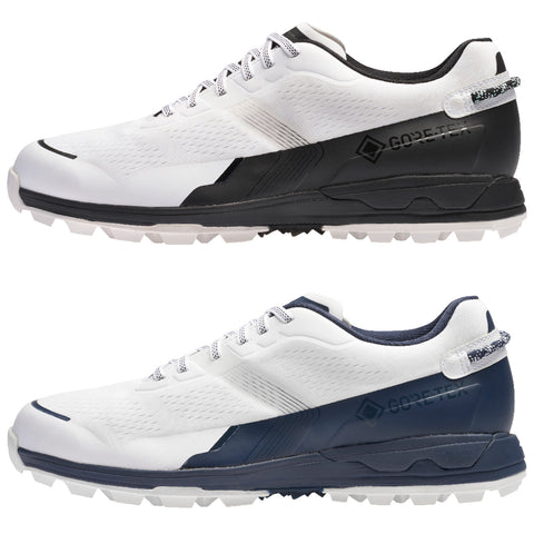 Two athletic shoes are displayed side by side featuring a white upper design with black and navy accents each having a textured surface and a rugged sole suitable for outdoor activity.