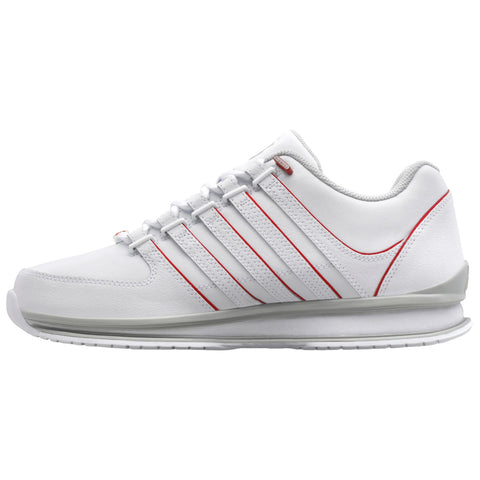 A white athletic sneaker features red accent stripes on the sides and a cushioned sole designed for comfort and support positioned against a plain white background.