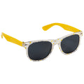 Colorful sunglasses with a transparent floral frame and yellow ear tips rest on a flat surface showcasing their dark lenses designed for sun protection.