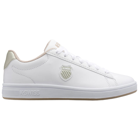 A white athletic shoe features a beige accent on the heel and a logo on the side. It is positioned against a plain background, emphasizing its clean design.