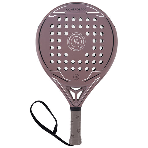 A padel racket features a perforated surface and a textured grip with a strap attached for security during play, typically found in sports settings or recreational areas.