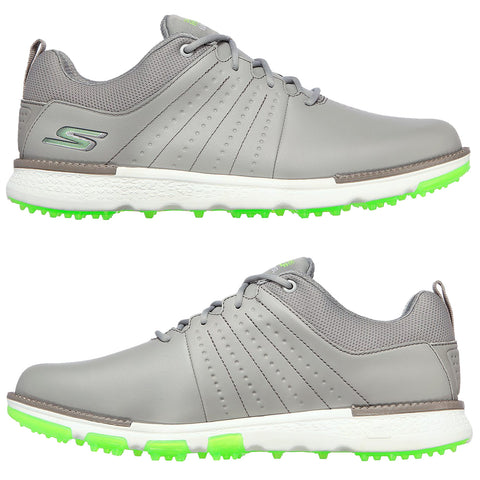 Gray golf shoes feature a smooth upper with perforations and a textured heel support. They have a white sole with bright green spikes designed for grip on grass.