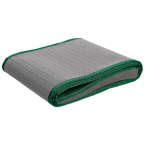 A gray mat with a textured surface is rolled up and secured with a green border resting on a neutral background suggesting it is ready for use in exercise or yoga.