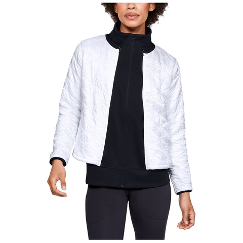 Under Armour Ladies Perpetual ColdGear Reactor Storm 2-in-1 Jacket A person is wearing a stylish white quilted jacket over a black zip-up top while standing with one hand raised in a neutral background suggesting a casual outdoor setting.