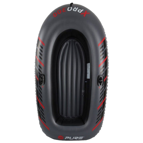 A black and gray inflatable boat with a spacious interior and red accents is positioned upright revealing smooth, ribbed flooring designed for seating in a water setting.