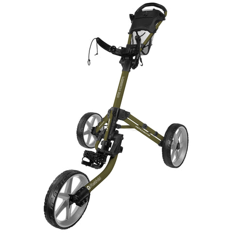 A golf push cart stands upright with three wheels. It features a handle, a mesh storage area, and a pedal mechanism for ease of movement. The background is plain.