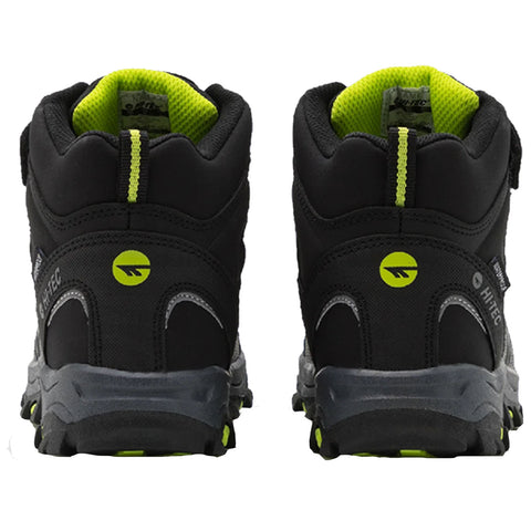 Black and gray hiking boots are positioned upright showing the back view with bright yellow accents and reflective logos designed for outdoor activities on rugged terrain.